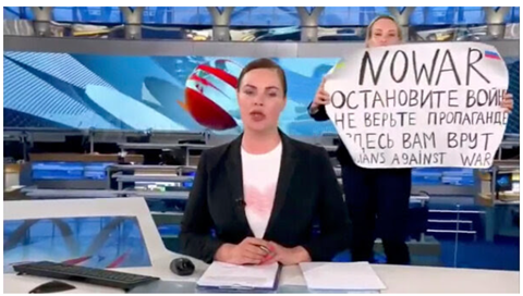 Russian television reporter who photo bombed their newscast with this anti-war poster