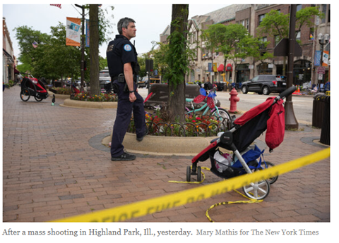 Picture of police officer standing in the middle of Highland Park with an empty stroller and caution tape streaming across