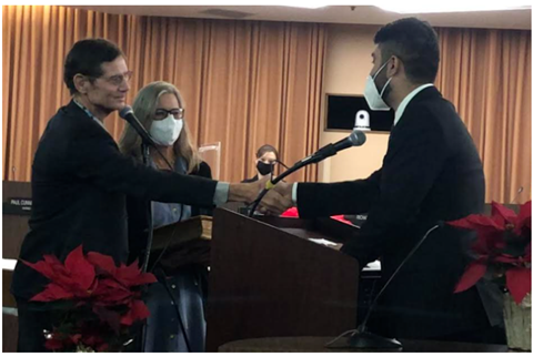 Picture of judge Ahmad swearing in Council Member Kozachik in December