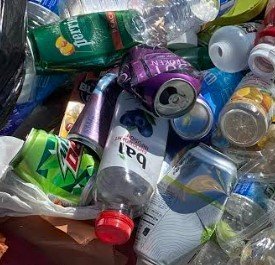 Picture shows pile of plastic bottles and aluminium cans
