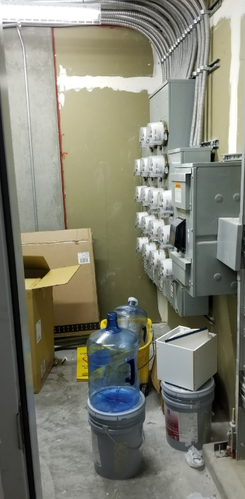 Picture shows electrical rooms doubling as storage for wet products