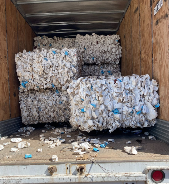 Picture shows several bales of plastic in the truck 