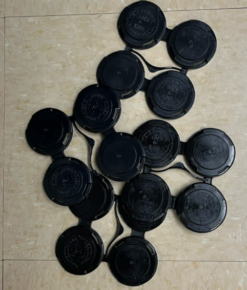 Picture shows several black can holders