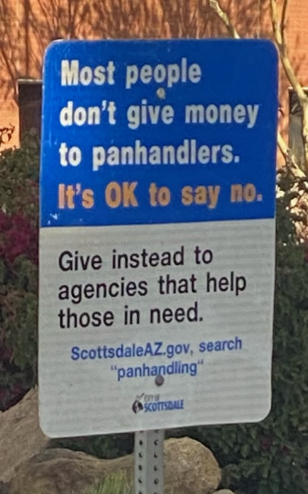 Picture shows City of Scottsdale "don't give money to panhandlers" sign posted in some areas