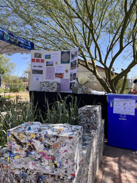 Picture shows Plastic Program booth at the community garden event