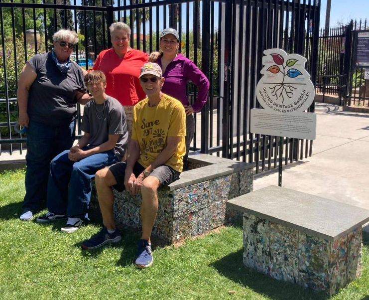 Picture of the planter and bench completed with Steve, Diana, Hilary Van Alsburg, Anita and her son from Bottle Rocket standing