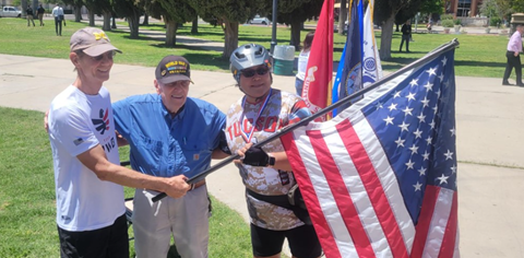 Picture -Left to right of Steve Kozachik, Don Sloane and Marcha Moon with US Flag