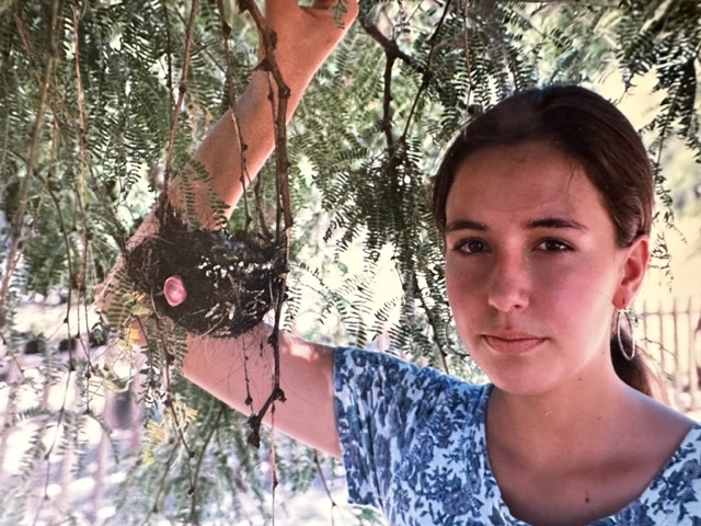 Xochitl with a bird's nest at the age of 12.