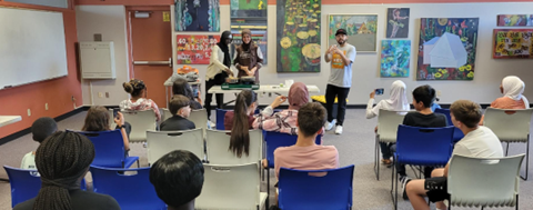 Steven Cota-Robles from Family Food Project explain how to make the noodle soup in front of the participants 