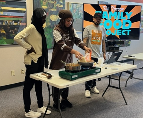 Abrar and Hanah help Steven making the noodle soup during the cooking demonstration 