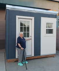 Sharon stand in front of ByPad at ward 6