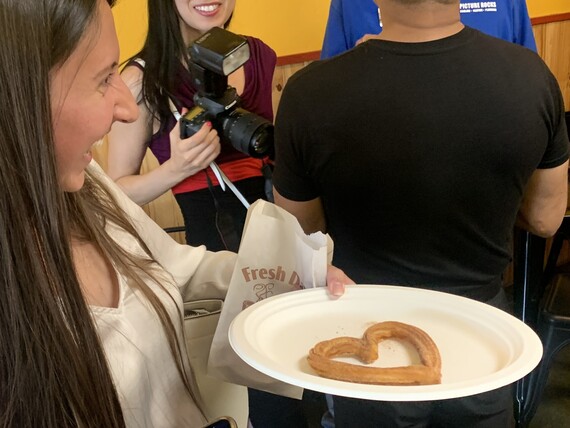 A lucky customer receives a heart shaped churro.