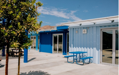 Picture of painted blue containers that is being utilize for learning space