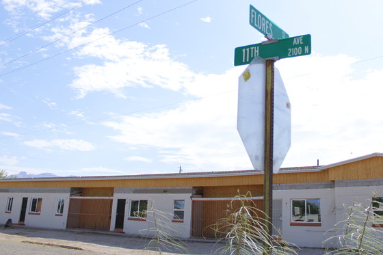 Photo of Street sign for the cross streets of 11th Avenue and Flores Street.