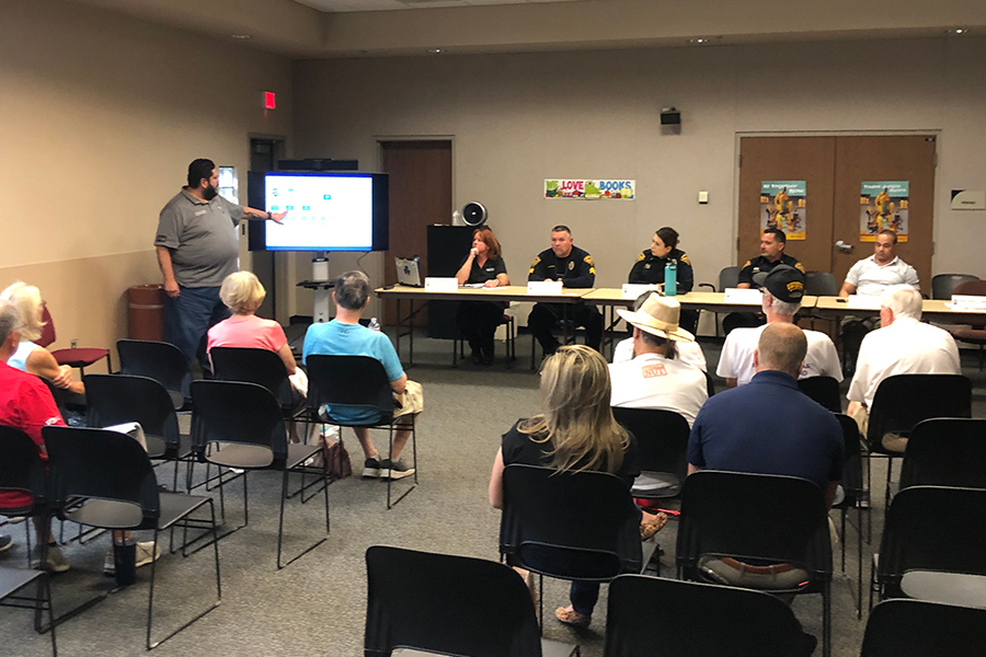 Community members and TPD ODE members in a meeting room.