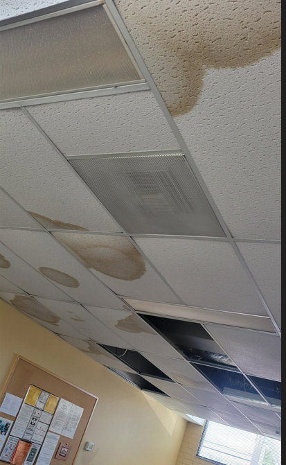 Picture shows several celling tiles gone due to storm last week  