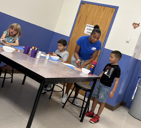 Photo of Amirah working at Kidco.