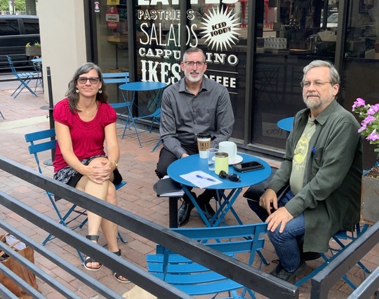 Photo of Council Member Dahl having coffee with constituents.