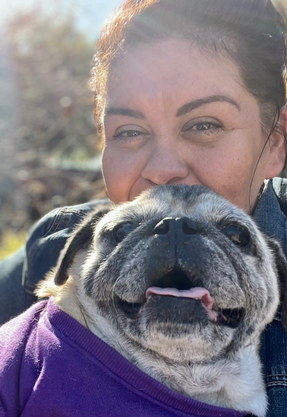 Photo of Denise with her pug named "Conchita".