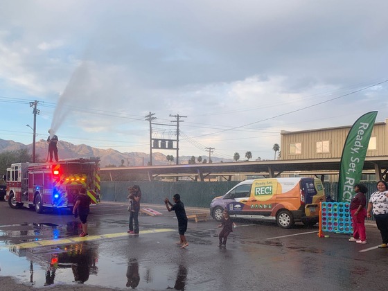 Photos of kids playing with firefighters at the Georgetown Apartments.