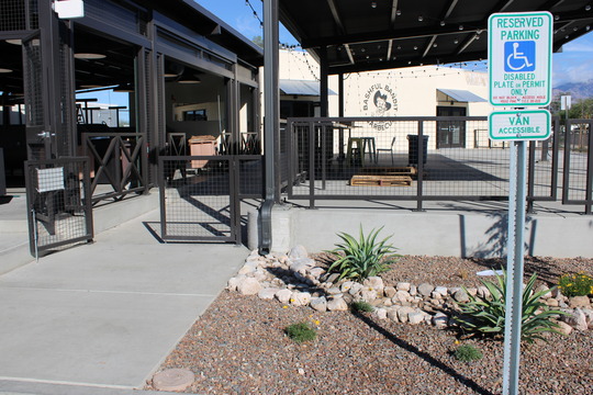 Photo of the back of the Bashful Bandit Barbeque Grill showing their water harvesting landscape.