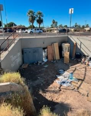 A culvert on 12th St and Valencia is blocked by some debris 