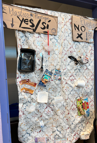Information board shows sample of recyclable plastics and sample of non recyclable items 