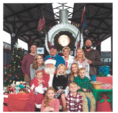 Picture with Santa in front of the train at Southern Arizona Transportation Museum 
