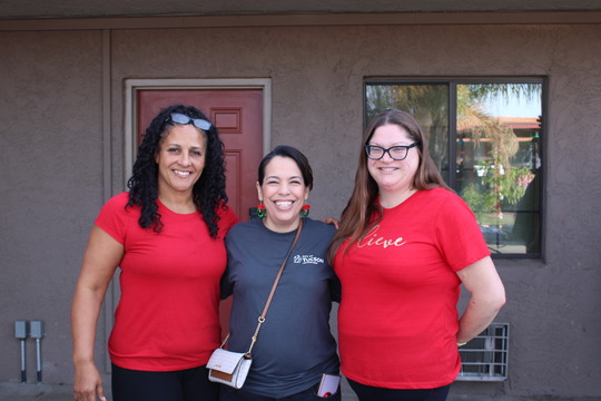 Photo of Brandi Champion, Liz Morales and Allison Chappell at the Wildcat Inn holiday party.