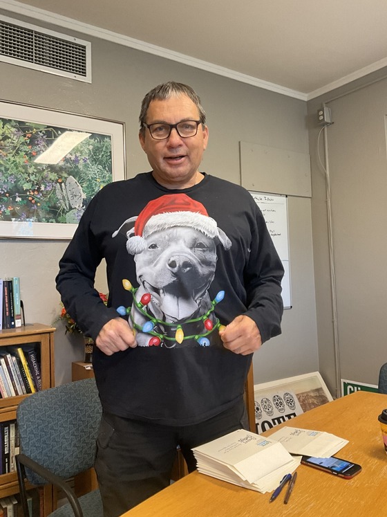 Phot of Community Liason Bennet Bernal wearing his favorite holiday sweater.