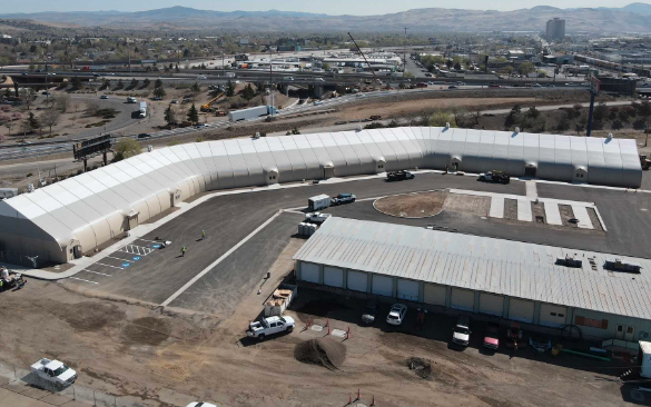 Reno just cut their homeless number in half by creating what they call their “Nevada Cares Campus.” Here’s an aerial of it: