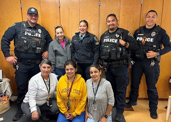TPD officers and child care workers take a group photo at a Southside Pre-K event.