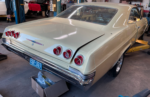 Picture of the back side of 1966 Impala in beige 