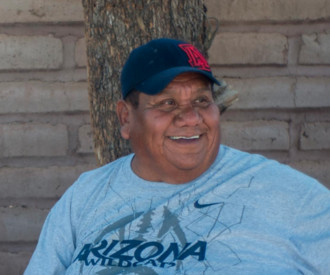 Picture of Bernard Siquieros wears Arizona Wildcat cap and shirt