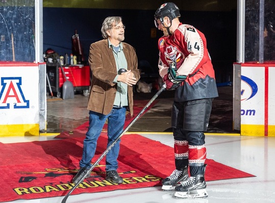 Photo of Vice Mayor Kevin Dahl dropping the puck at the Tucson Road Runners Hockey game.