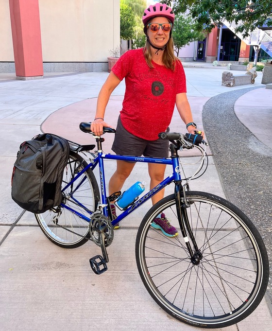 Photo of Ann and her bicycle outside of the City of Tucson Complex on Bonita Ave.