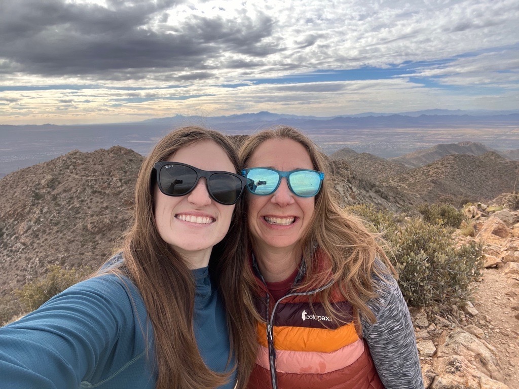 Photo of Ann and a friend on a hike.