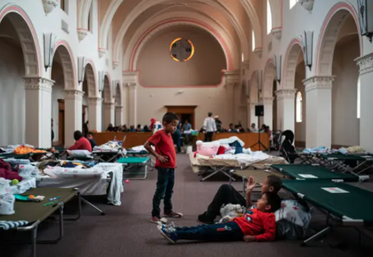 Picture of the inside of Benedictine being used as a shelter for migrants