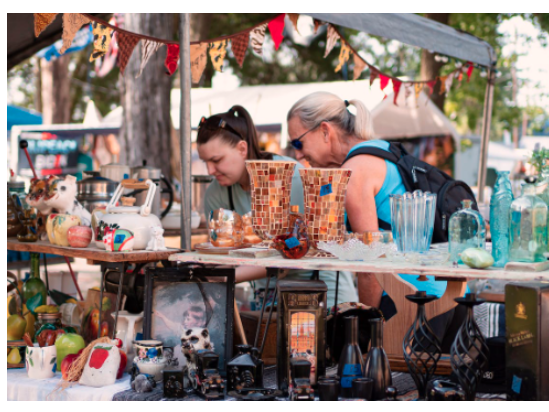 2 women participate in crafting at the event