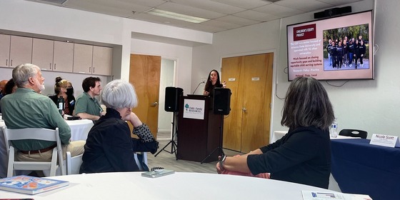 Photo of Dr. Shantel Meek - author of the Start with Equity Arizona report sharing out to an audience of dedicated early education advocates.