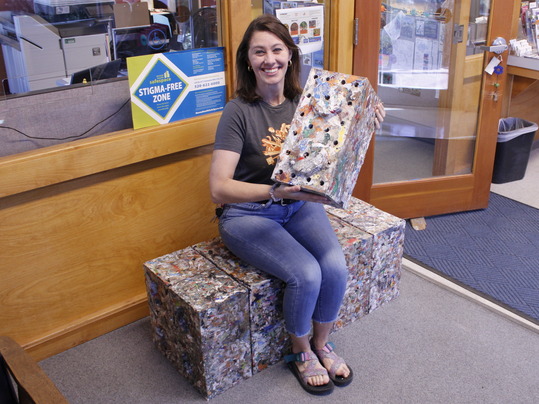 Photo of Shannon with recycled plastic brick.