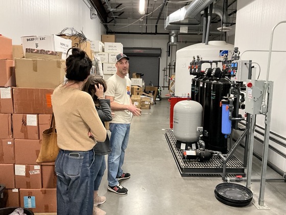 Photo of Marlene Avelino and Shannon Jenkins Getting a tour of the growth facilities at the Prime Leaf.