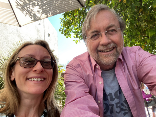 Photo of Angela Hughes and Vice Mayor Dahl in the courtyard at Raging Sage.