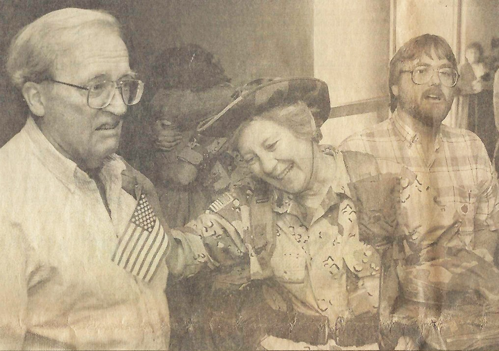 Newspaper photo of Colonel Jeannine Dahl returning from deployment in Desert Storm.