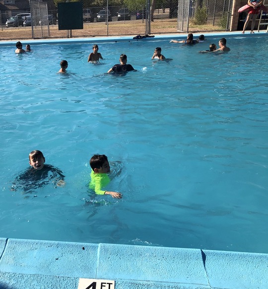 Photo of kids swimming at Mansfield pool.