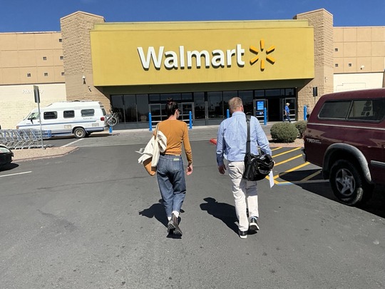 Photo of Marlene Avelino and Rory Juneman walking into Walmart.