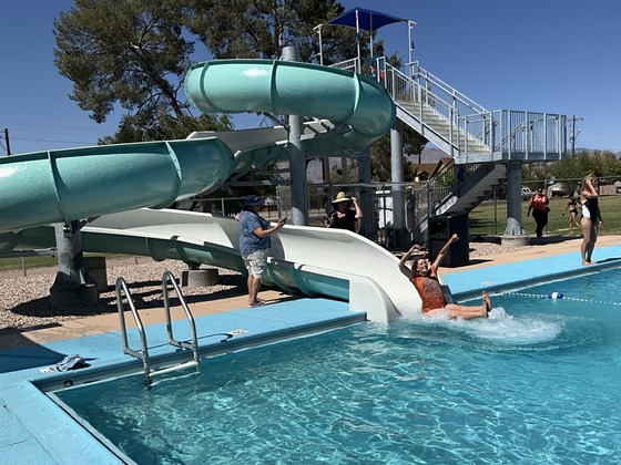 Photo of Ward 3 Chief Of Staff Katie Bolger taking a plunge from the Mansfield slide.
