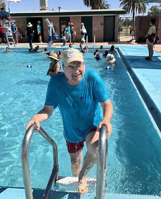 Photo of Vice Mayor Kevin Dahl exiting Mansfield Pool after a swim.