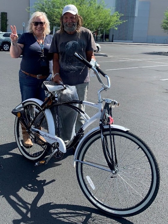 Photo Kristin Woodall and Jimmy with the new tires on his bike courtesy of the Ward 3 office.
