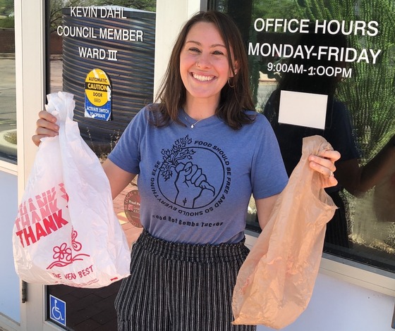 Photo of Shannon holding plastic bags.